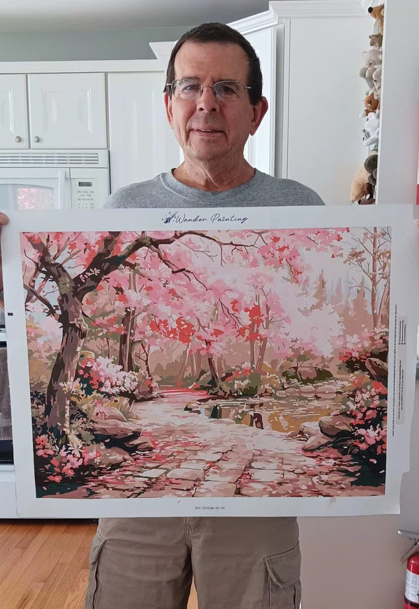 Man holding cherry blossom path